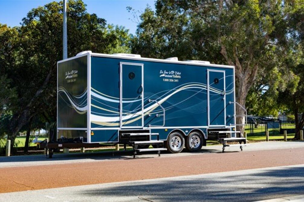 Portable toilet platinum series parked on a grassy area